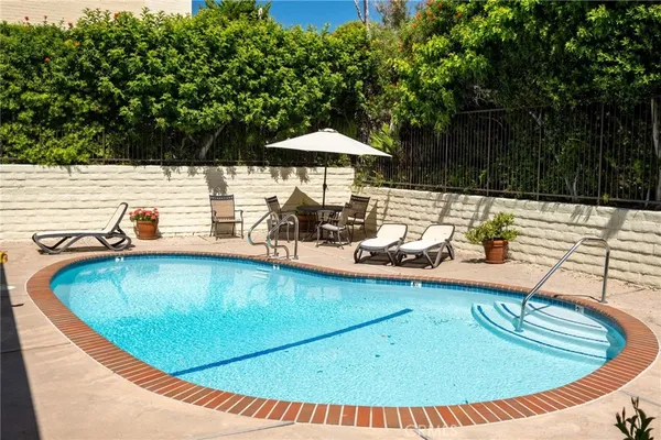 a view of a swimming pool with a patio