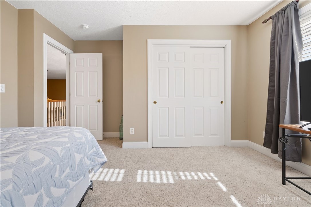 841 Willow Road Springfield, OH 45502 - Photo 26 of 64 This cozy bedroom features plush carpet and ample natural light, creating a bright and inviting atmosphere.