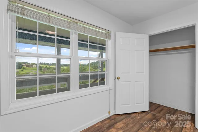 a view of empty room with windows