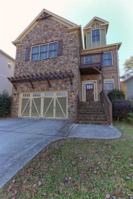 3302 Osborne Road Northeast Brookhaven, GA 30319 - Photo 1 of 1 a front view of a house with a yard