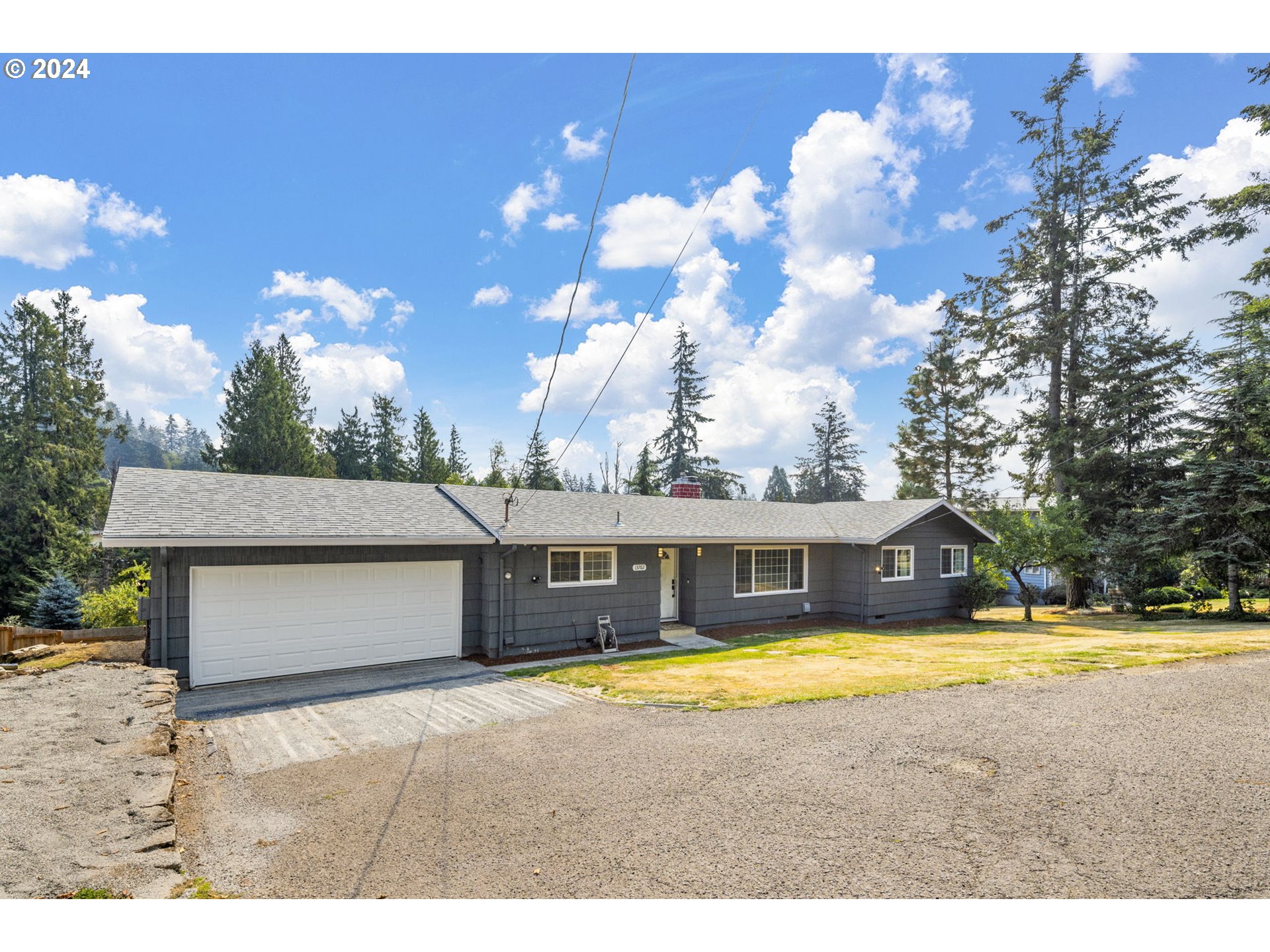 13762 Southeast Wiese Road Damascus, OR 97089 - Photo 2 of 44 a view of a house with swimming pool