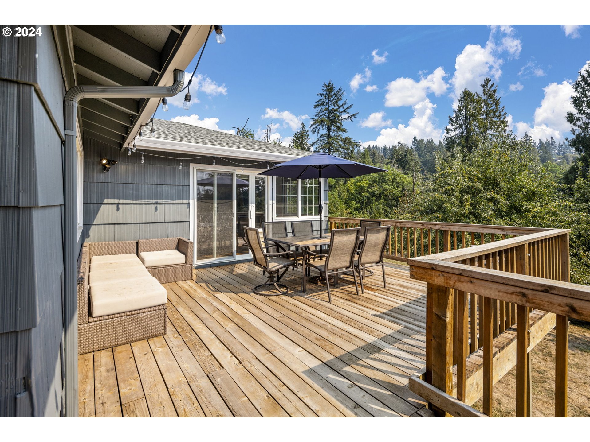 13762 Southeast Wiese Road Damascus, OR 97089 - Photo 28 of 44 a view of a balcony with chairs and wooden floor