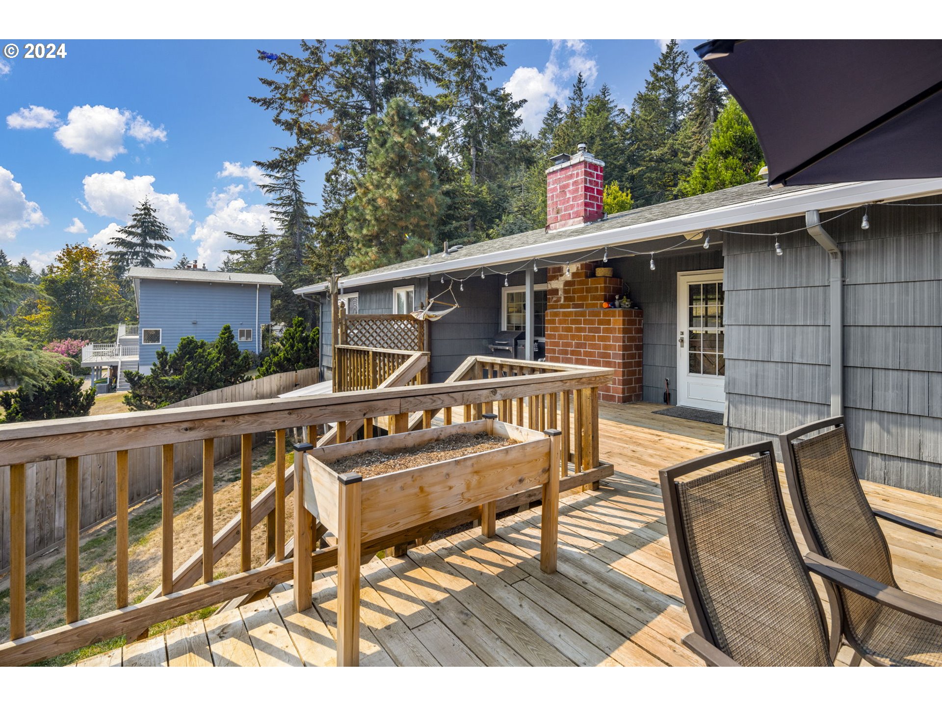13762 Southeast Wiese Road Damascus, OR 97089 - Photo 29 of 44 a balcony with wooden floor and outdoor seating