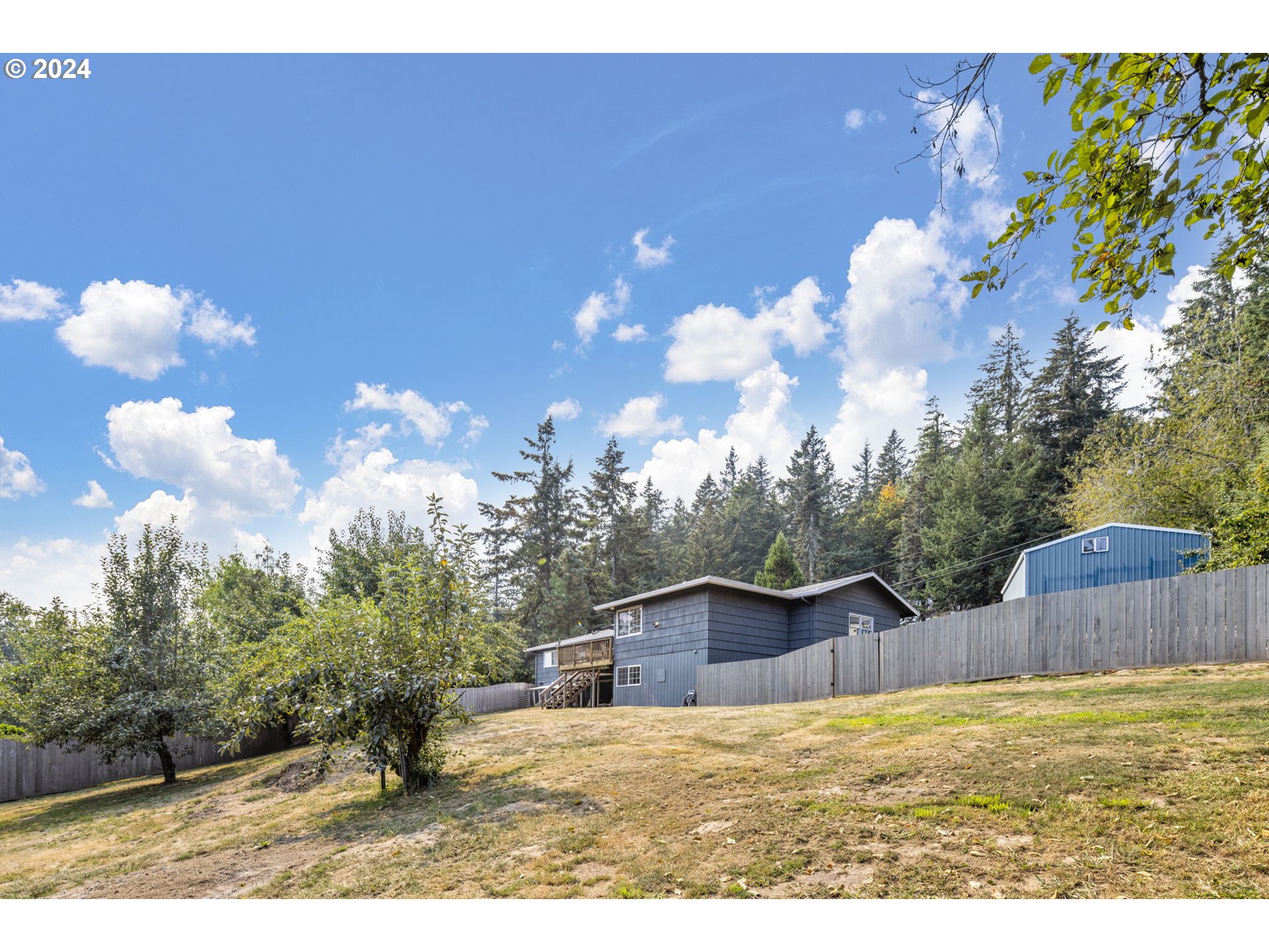 13762 Southeast Wiese Road Damascus, OR 97089 - Photo 35 of 44 a view of a house with a yard