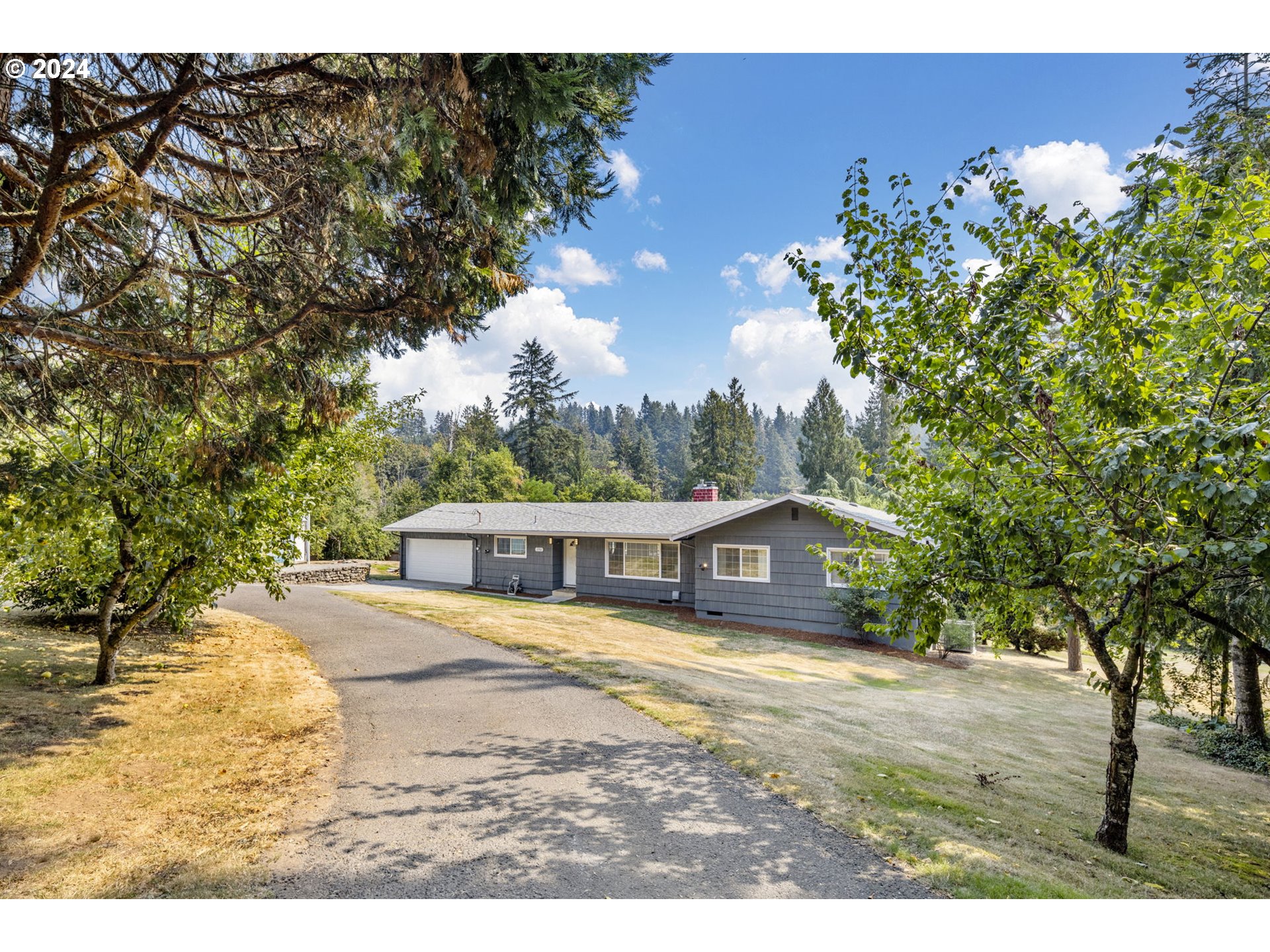 13762 Southeast Wiese Road Damascus, OR 97089 - Photo 5 of 44 a view of house with outdoor space and garden