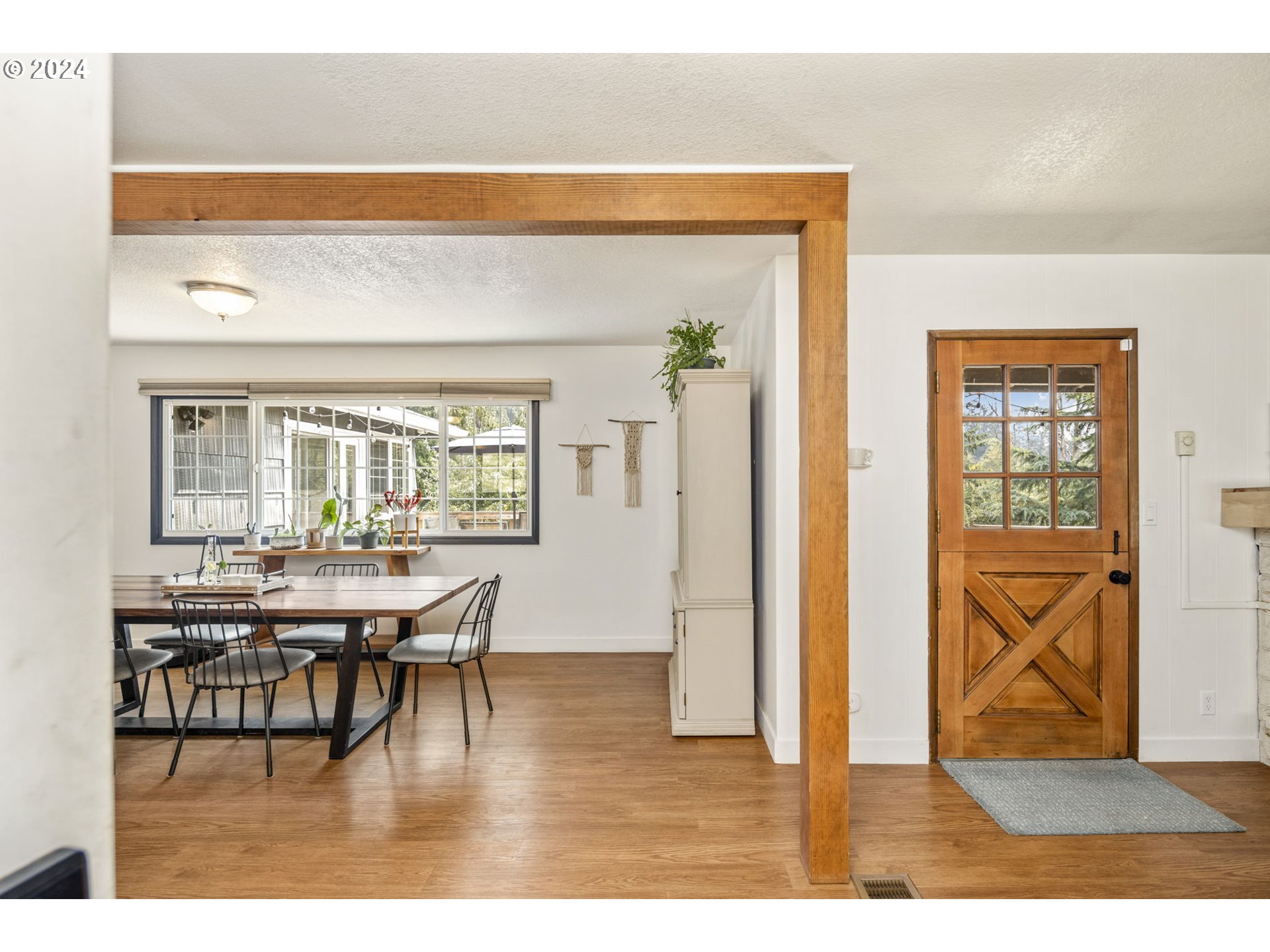 13762 Southeast Wiese Road Damascus, OR 97089 - Photo 6 of 44 a view of a dining room with furniture and wooden floor