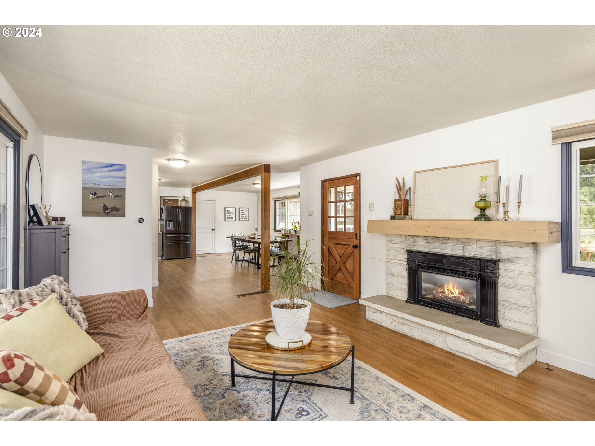 13762 Southeast Wiese Road Damascus, OR 97089 - Photo 9 of 44 a living room with furniture and a fireplace