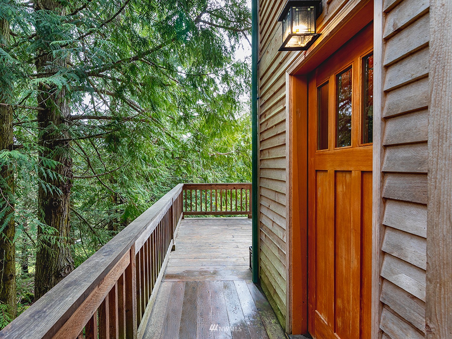 1864 Lost Mountain Road Sequim, WA 98382 - Photo 19 of 35 a view of balcony with wooden floor and fence