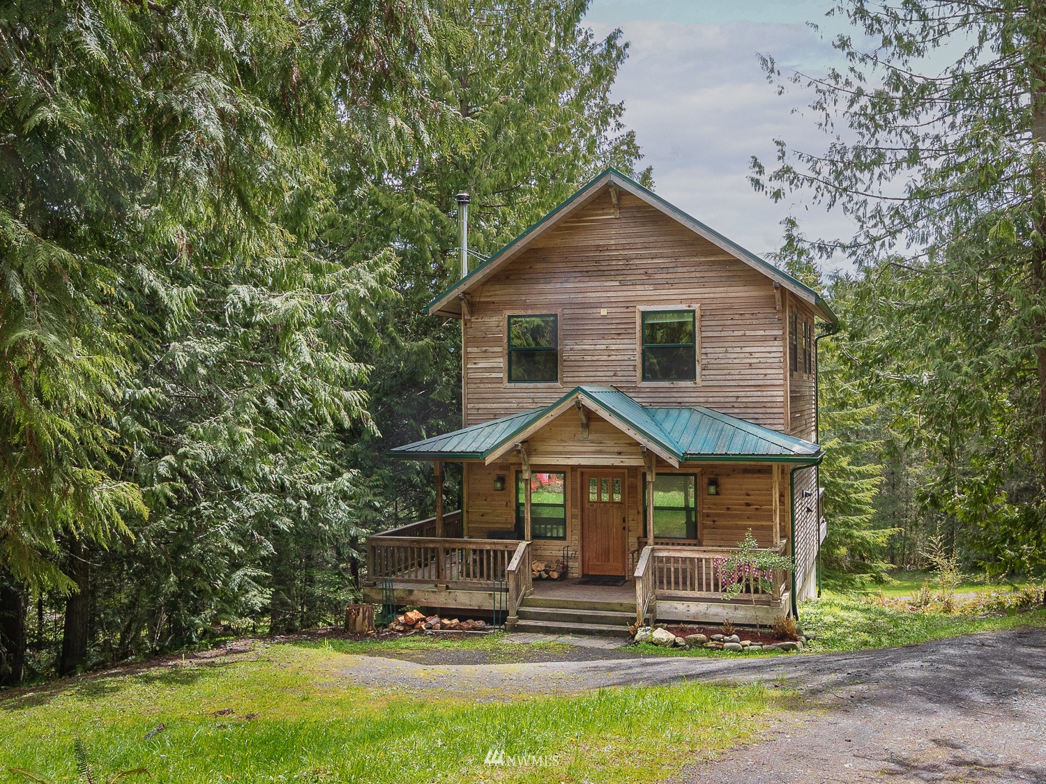 1864 Lost Mountain Road Sequim, WA 98382 - Photo 2 of 35 a front view of house with yard and green space