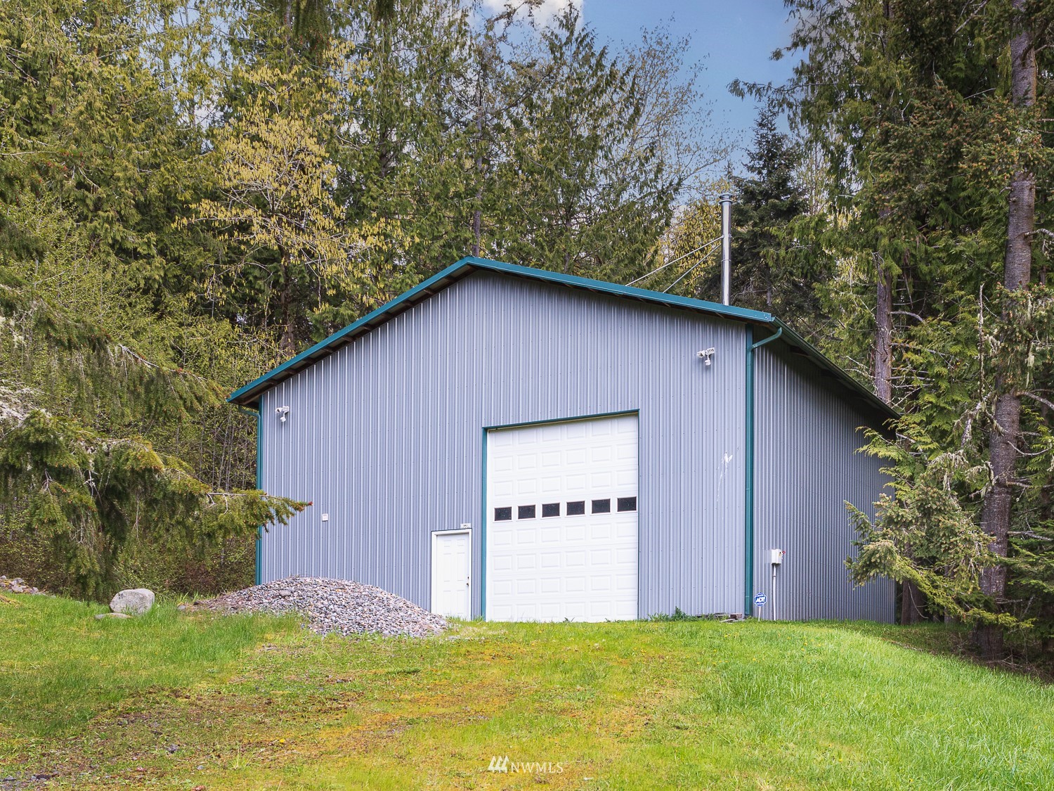 1864 Lost Mountain Road Sequim, WA 98382 - Photo 27 of 35 a view of an house with backyard space and garden