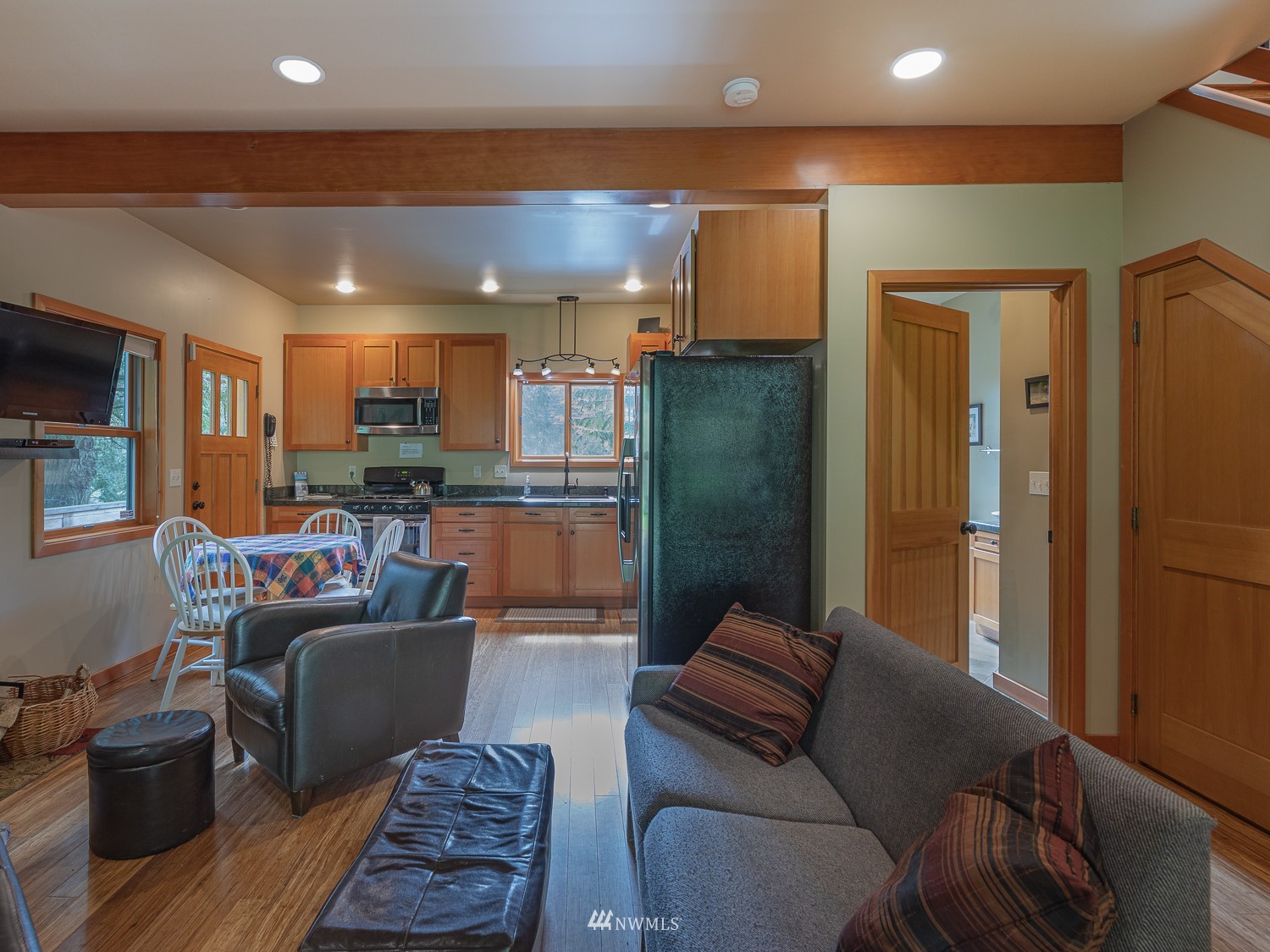 1864 Lost Mountain Road Sequim, WA 98382 - Photo 6 of 35 a living room with furniture and a view of kitchen