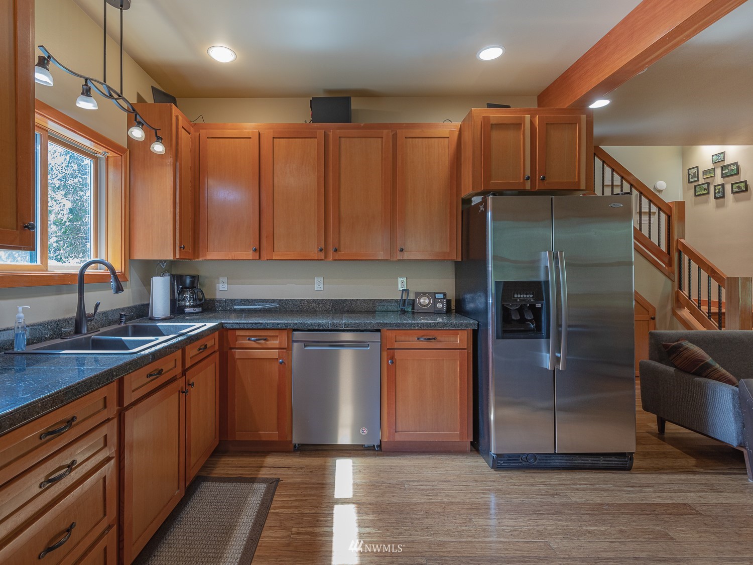 1864 Lost Mountain Road Sequim, WA 98382 - Photo 8 of 35 a kitchen with stainless steel appliances granite countertop a refrigerator and a sink