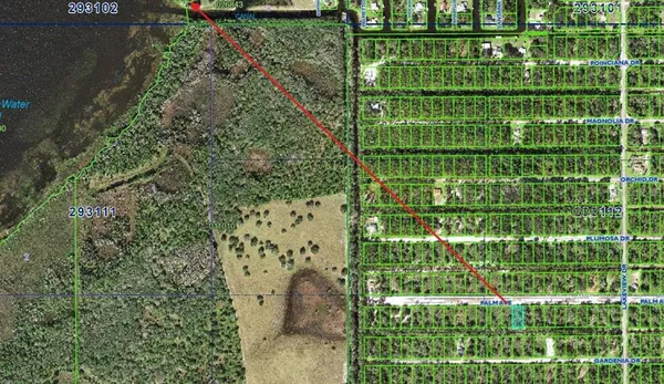 a view of a lake with houses in the back