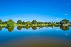 a view of a lake with a yard