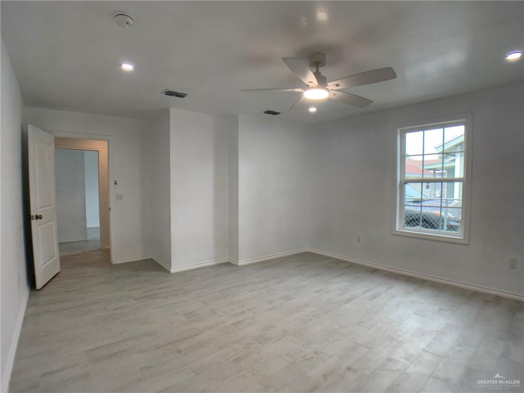 10824 Compadres Street Mercedes, TX 78570 - Photo 15 of 19 an empty room with closet and windows