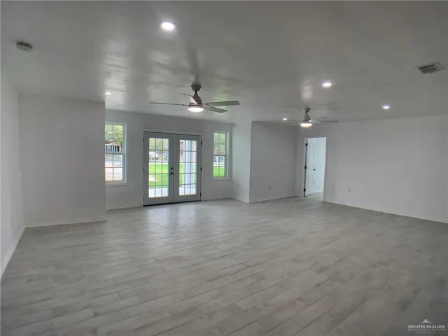 a view of an empty room and window