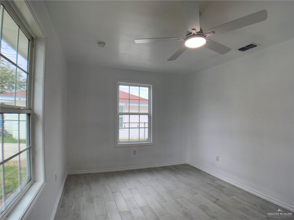 10824 Compadres Street Mercedes, TX 78570 - Photo 10 of 19 an empty room with window