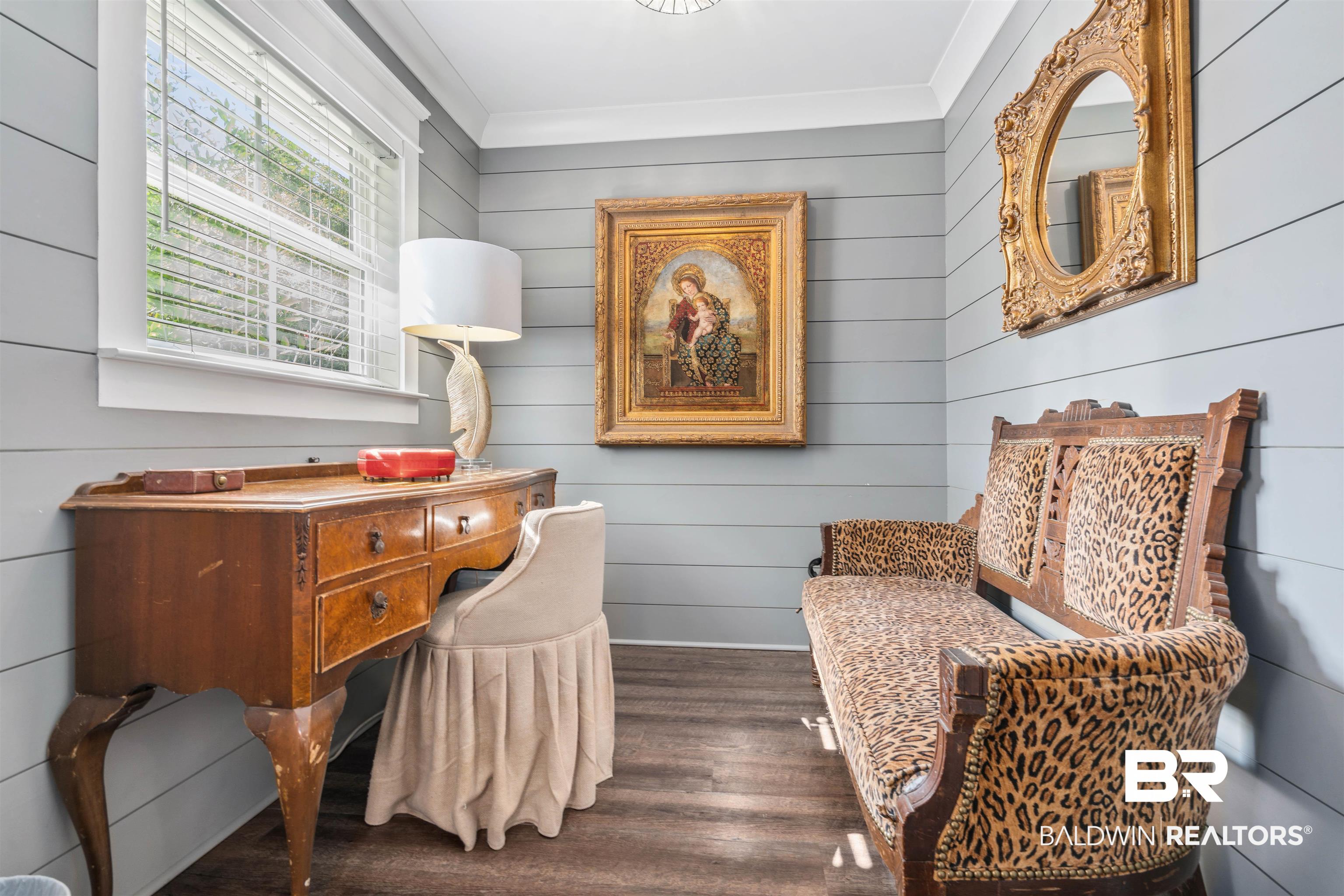 3808 Claridge Road North Mobile, AL 36608 - Photo 33 of 43 Sitting room featuring wood walls, crown molding, and dark hardwood / wood-style flooring