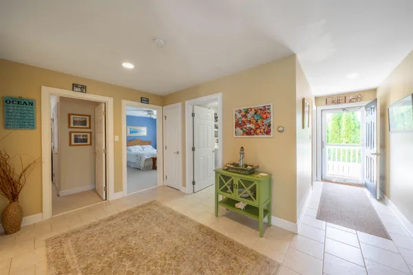 a view of a livingroom with workspace and a window