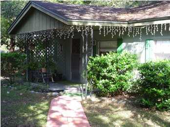 48 Carol Place Freeport, FL 32439 - Photo 12 of 17 a front view of a house with garden