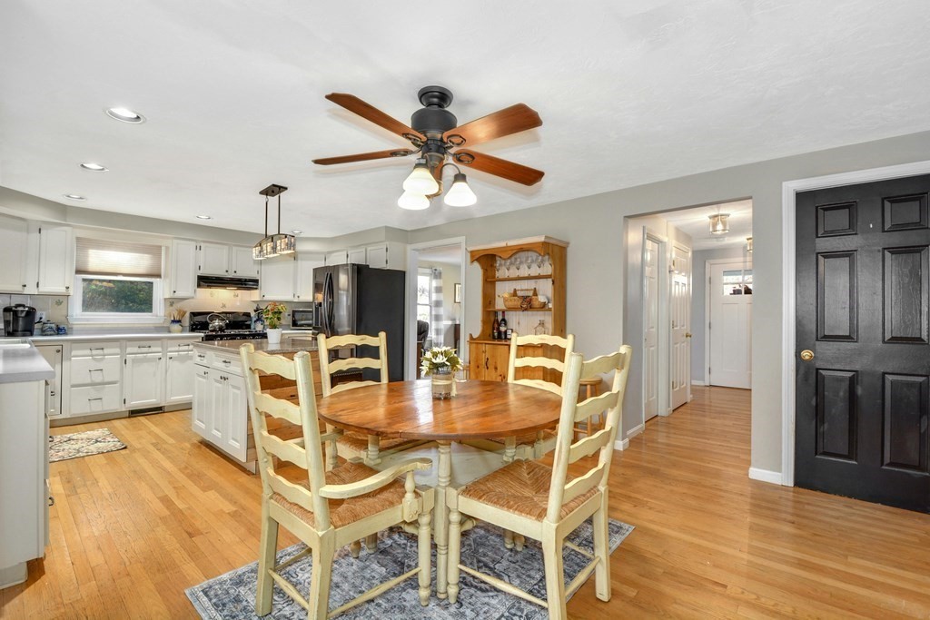 16 Barrett Road Marlborough, MA 01752 - Photo 16 of 41 a view of a dining room with furniture a kitchen and chandelier