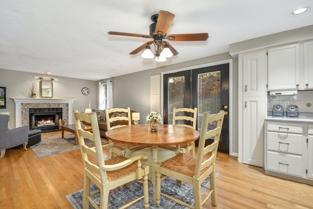 16 Barrett Road Marlborough, MA 01752 - Photo 17 of 41 a dining room with furniture a fireplace and wooden floor