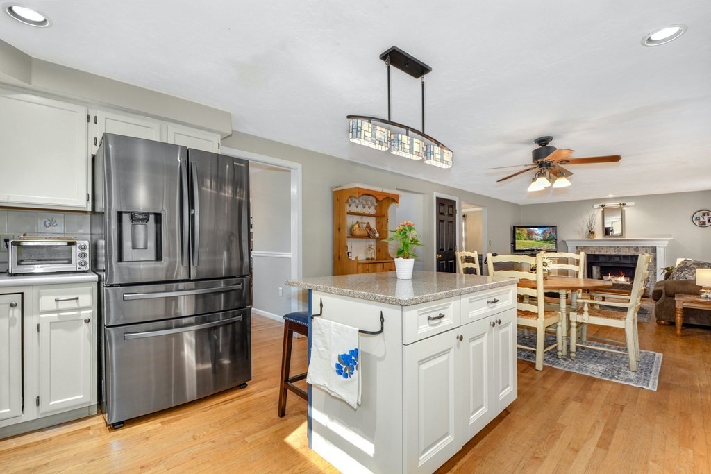 16 Barrett Road Marlborough, MA 01752 - Photo 20 of 41 a kitchen with stainless steel appliances granite countertop a refrigerator a stove top oven a sink dishwasher and white cabinets with wooden floor