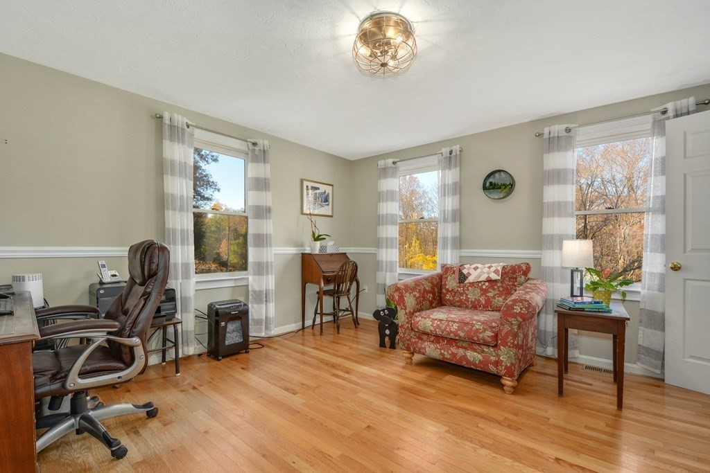 16 Barrett Road Marlborough, MA 01752 - Photo 22 of 41 a living room with furniture a large window and gym equipment