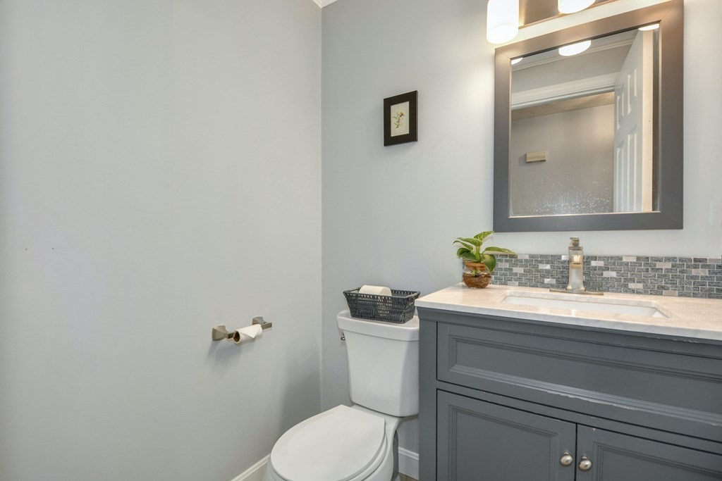 16 Barrett Road Marlborough, MA 01752 - Photo 24 of 41 a bathroom with a granite countertop toilet sink and mirror