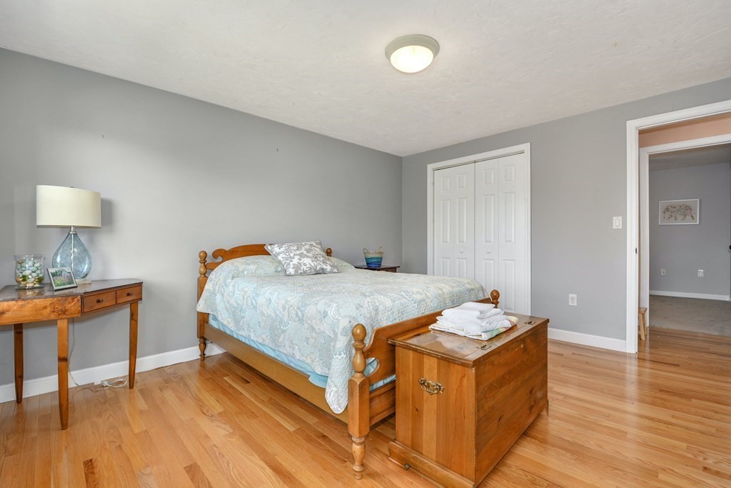 16 Barrett Road Marlborough, MA 01752 - Photo 31 of 41 a bedroom with a bed and a table in it