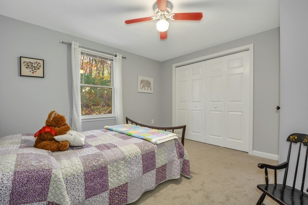 16 Barrett Road Marlborough, MA 01752 - Photo 32 of 41 a bedroom with a bed and a window