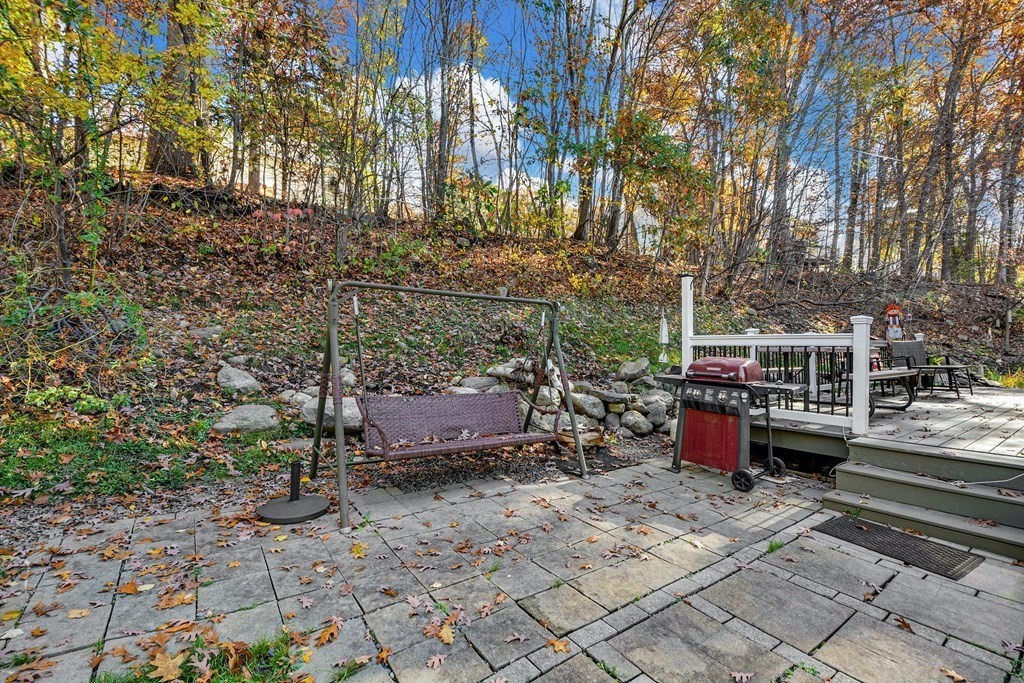 16 Barrett Road Marlborough, MA 01752 - Photo 38 of 41 a backyard of a house with barbeque oven and outdoor seating
