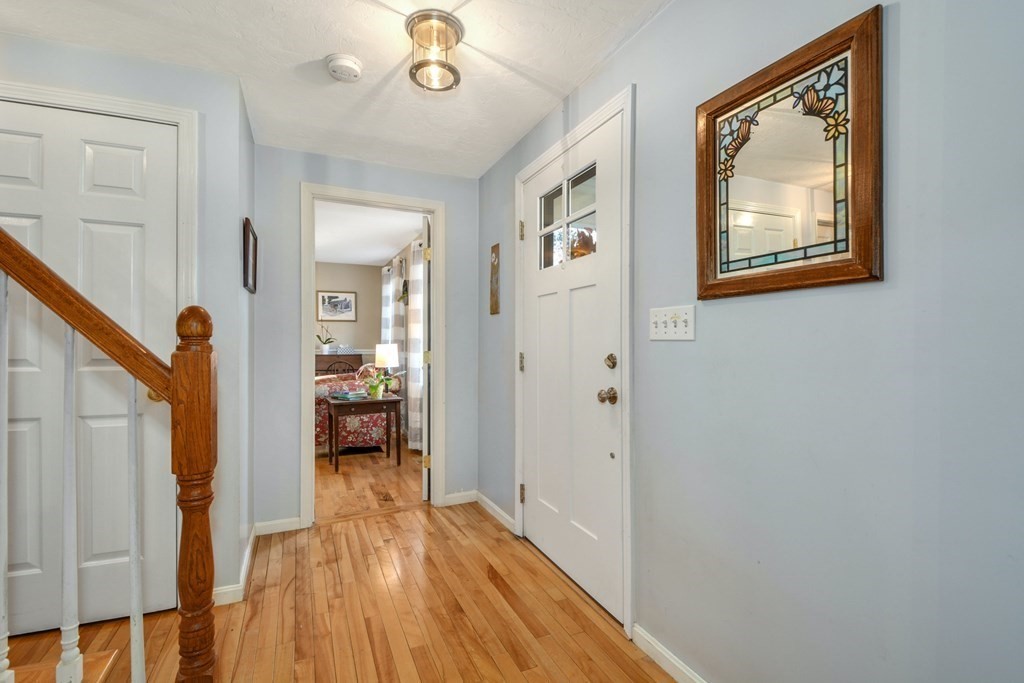 16 Barrett Road Marlborough, MA 01752 - Photo 7 of 41 a view of a hallway with wooden floor and a living room