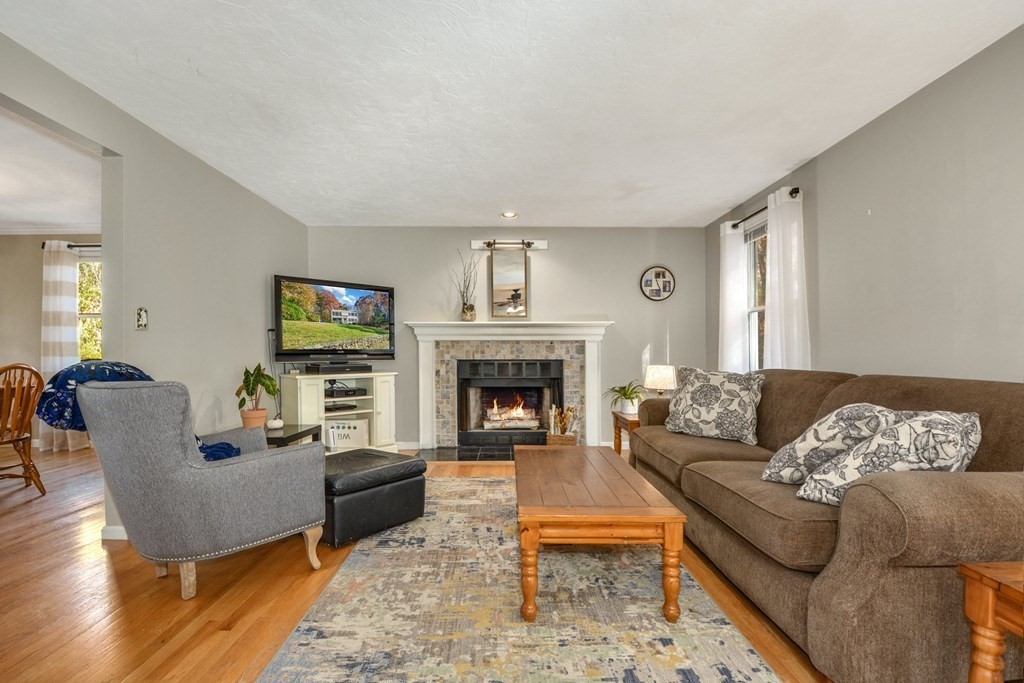 16 Barrett Road Marlborough, MA 01752 - Photo 10 of 41 a living room with furniture and a fireplace