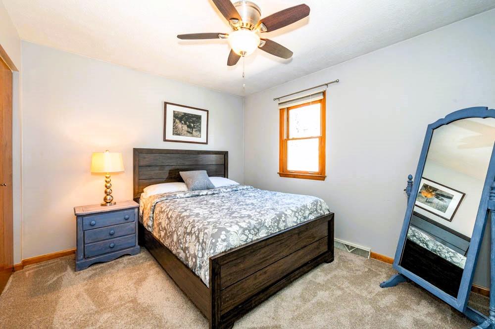 24 Lynmar Road Pittsburgh, PA 15209 - Photo 18 of 39 a bedroom with a bed and a ceiling fan
