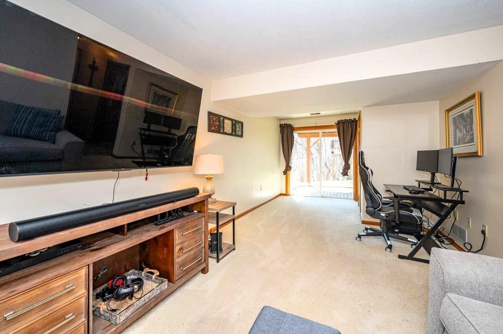 24 Lynmar Road Pittsburgh, PA 15209 - Photo 24 of 39 a living room with furniture a flat screen tv and a window