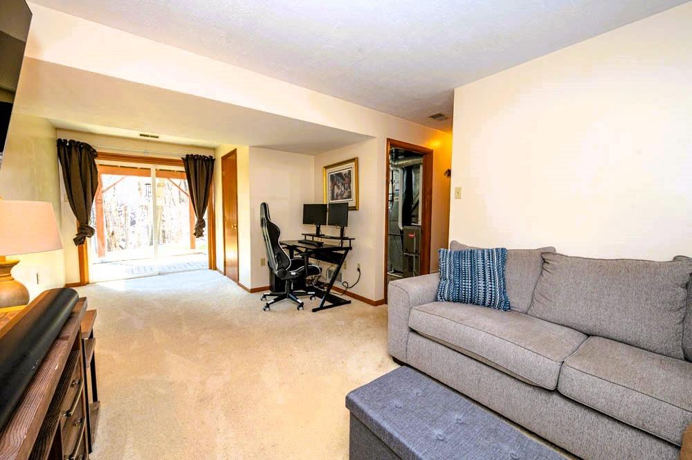 24 Lynmar Road Pittsburgh, PA 15209 - Photo 25 of 39 a living room with furniture and a large window