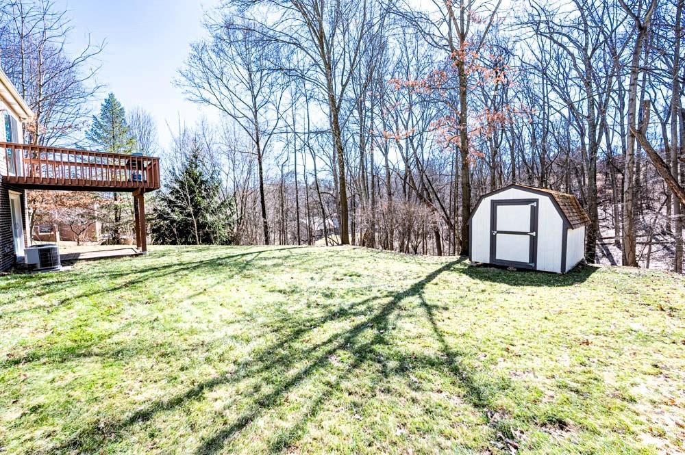 24 Lynmar Road Pittsburgh, PA 15209 - Photo 30 of 39 a backyard of a house with a yard and garage
