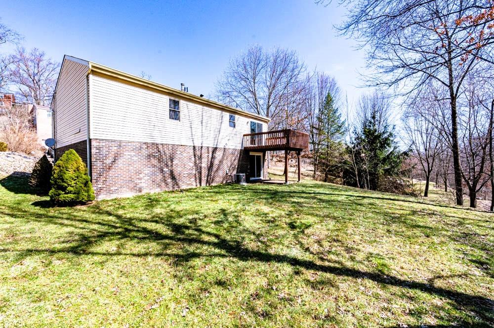 24 Lynmar Road Pittsburgh, PA 15209 - Photo 33 of 39 a backyard of a house with lots of green space and fountain