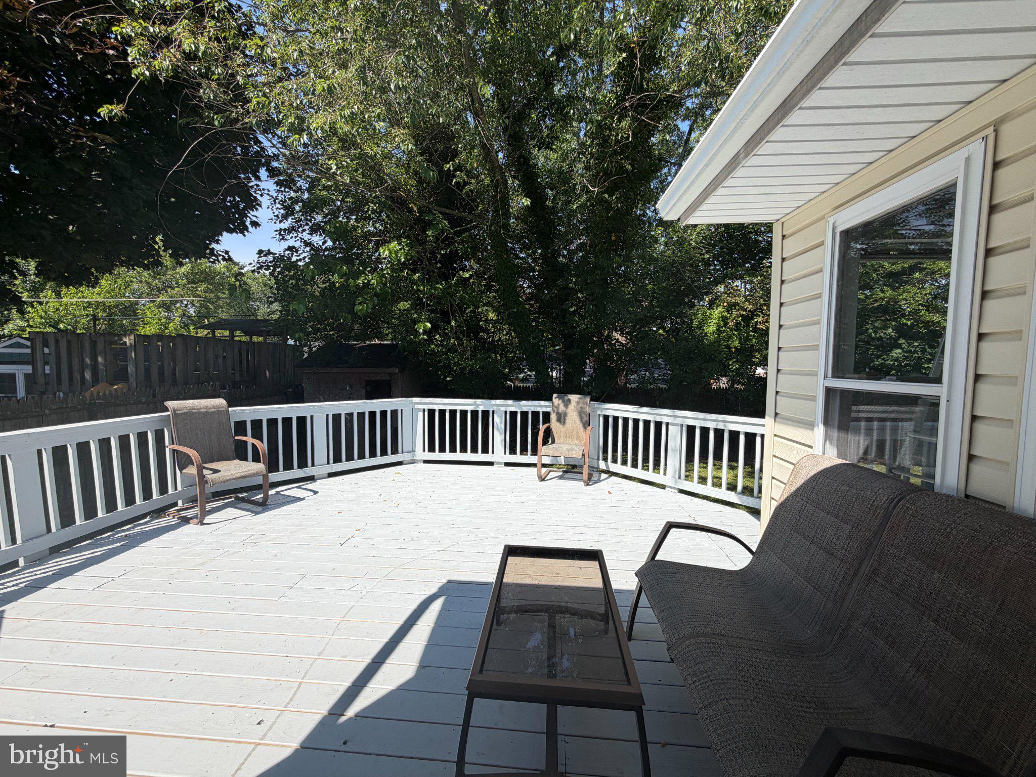 5915 Charnwood Road Catonsville, MD 21228 - Photo 21 of 21 Sunny deck with serene greenery.