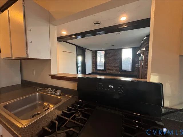 a living room with furniture and potted plant