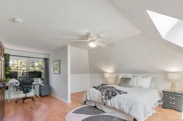 a bedroom with a bed and a table in it