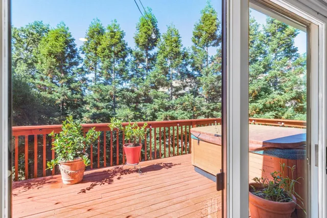 a view of a balcony with wooden floor