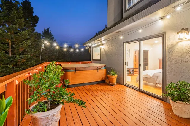 a view of a patio with couches under an umbrella
