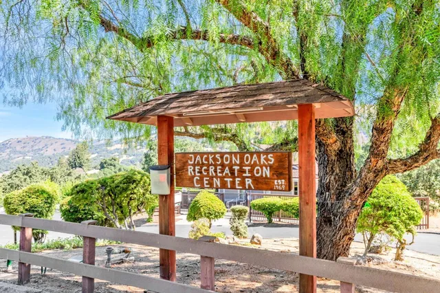 a swimming pool with outdoor seating and yard