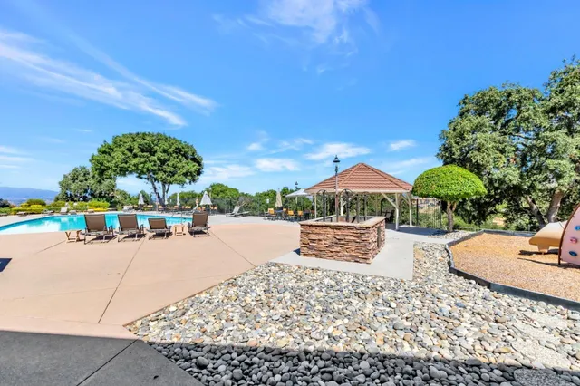 a view of a swimming pool with a lounge chairs