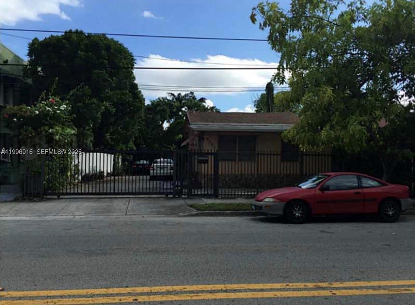 a front view of a house with parking space
