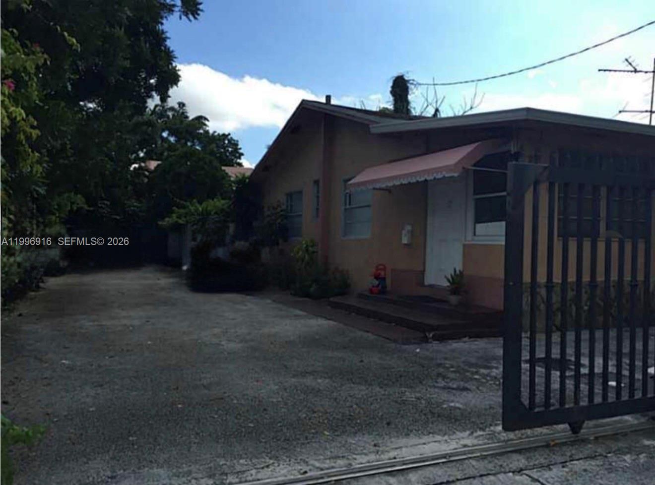 2528 Southwest 16th Street Miami, FL 33145 - Photo 2 of 6 a view of a house with a yard