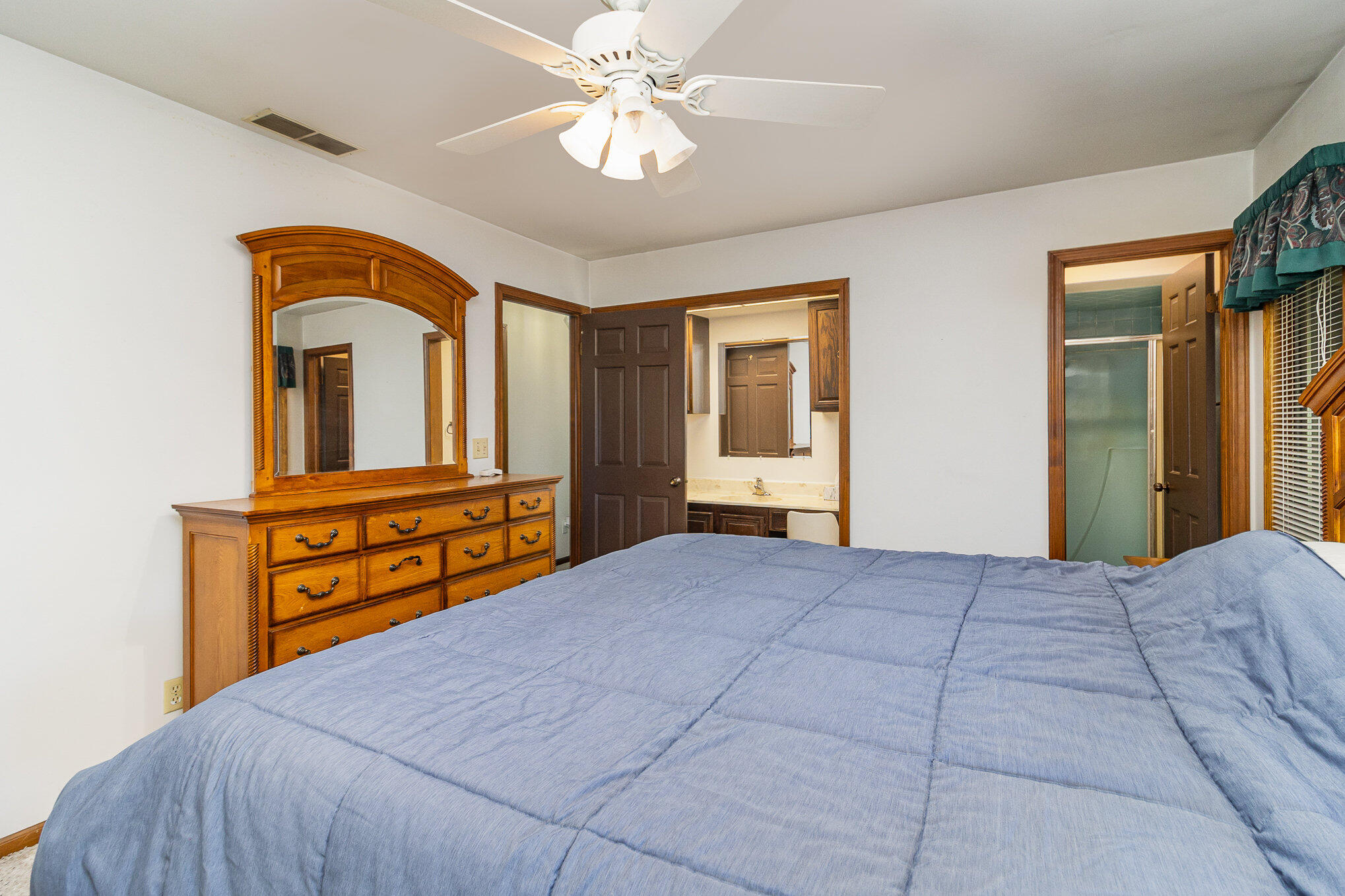 274 Highway 2 Hebron, IN 46341 - Photo 7 of 18 a bedroom with a bed and a chandelier