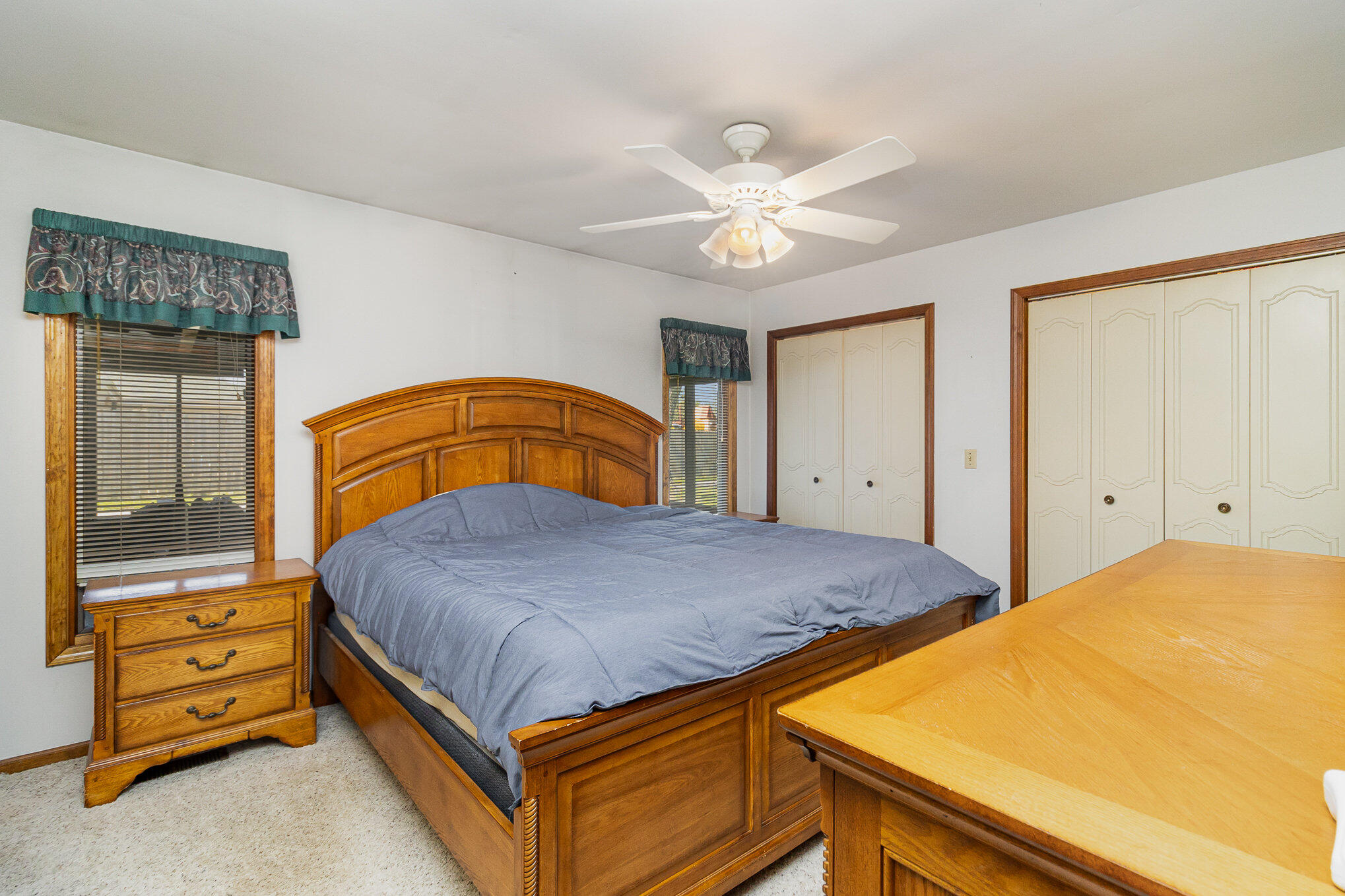 274 Highway 2 Hebron, IN 46341 - Photo 8 of 18 a bedroom with a bed and a chandelier